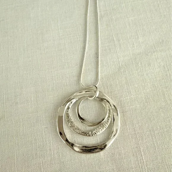 Silvertone Necklace 22-24 inches with Pendant Trio of Irregular Textured Rings - Picture 3 of 7